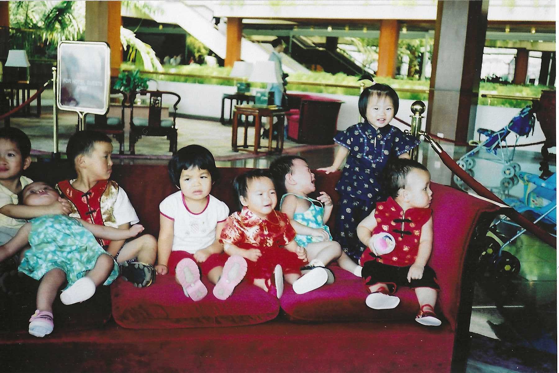 The famous red couch at the White Swan Hotel in Guangzhou that nearly every Chinese adoptee has sat on. I'm the one on the far right wearing red.